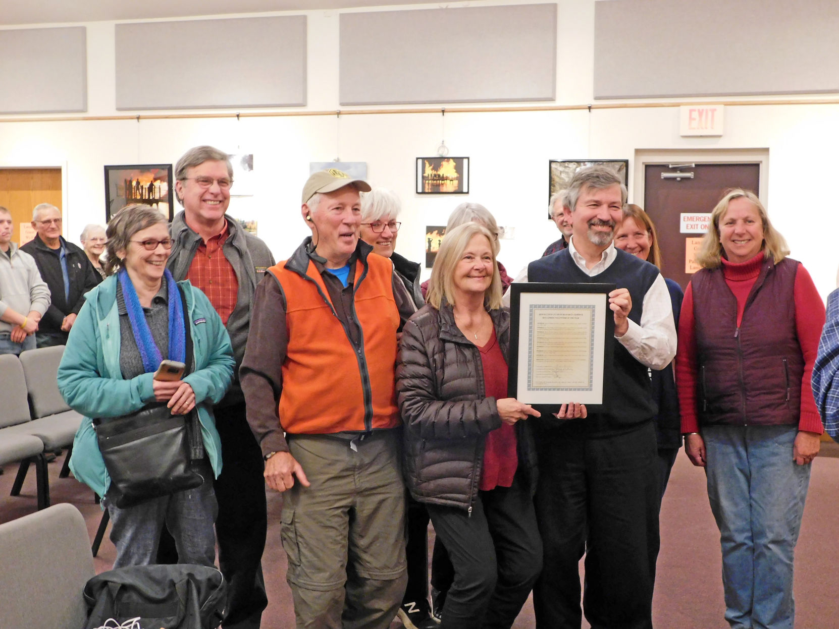 Marcia Herrick and members of the trail committee pose for a photo with her and her award. Front row (left to right): Deborah Trumbull, Roger Hopkins, Marcia Herrick, Edward LaVigne and Reenie Baker Sandsted. Back row: Gary Mallow, Ruth Hopkins, Maureen Cowan and Susan Ruoff.